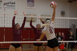 Hannah Joly, freshman outside hitter, goes up for a spike against IU East. The Grenadiers swept the match in straight sets.