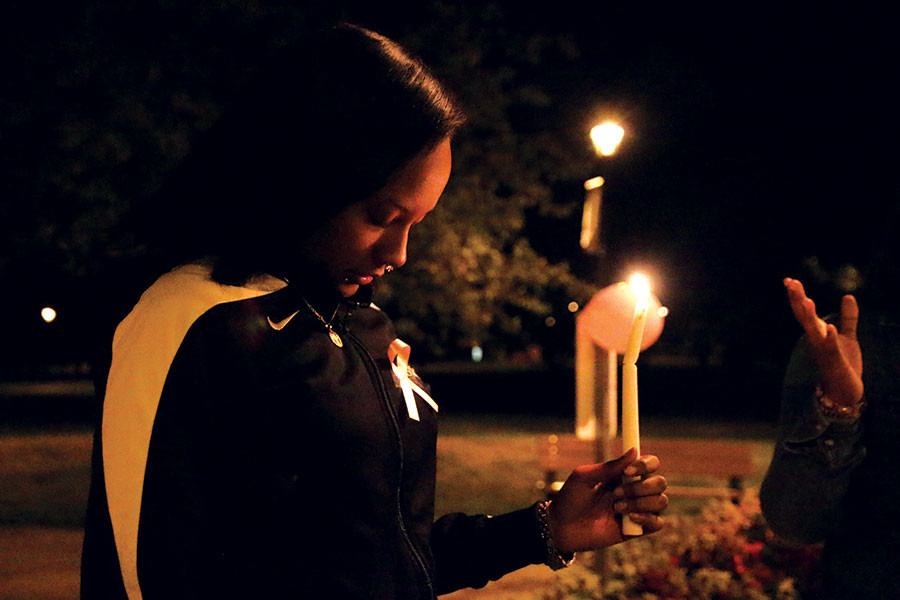 Francesca+Komora%2C+sociology+junior%2C+holding+a+candle+while+they+say+a+prayer+at+the+beginning.