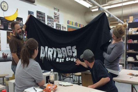 Photo courtesy of Bethany Barton Dirt Bags Art Club members looking at their logo designed by Parker Bolin.