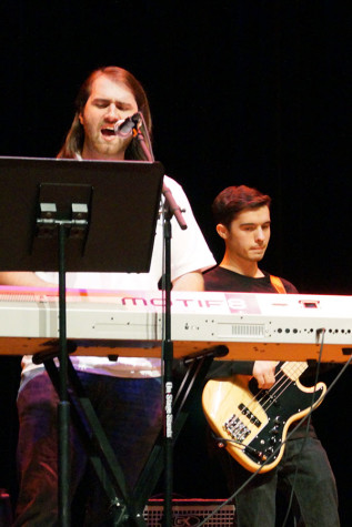 Curtis Merrill, music senior, and Bobby Conley, music sophomore, perform as AMC in Fallstock. AMC is the cover rock band in Sound Together.