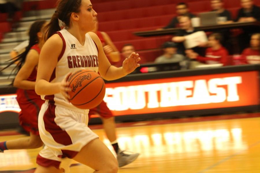 Junior+forward+Michaela+Harris+pushes+the+ball+on+a+Grenadier+fast+break.+