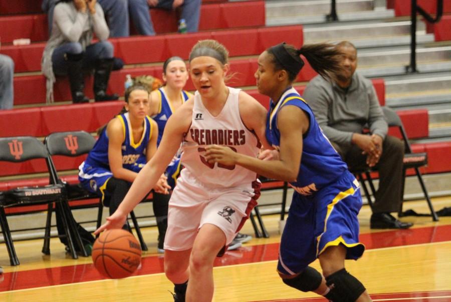 Freshman+forward+Halea+Petro+drives+the+ball+past+the+Brescia+defender.+