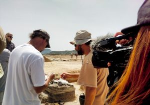 A student filming Albert William (left), research associate in the Media Arts and Sciences department at IUPUI and one of the coordinators for the IUPUI study abroad trip to Greece, working with one of the archaeologists at an active archaeological site on the island of Despotiko off the coast of Paros, Greece in the Cyclades. 