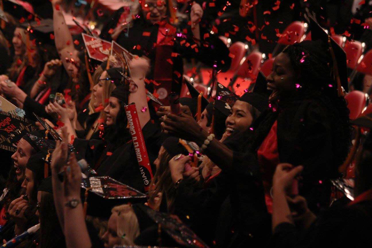 Graduates+celebrate+after+receiving+their+diplomas+in+Freedom+Hall+on+Monday+night.+