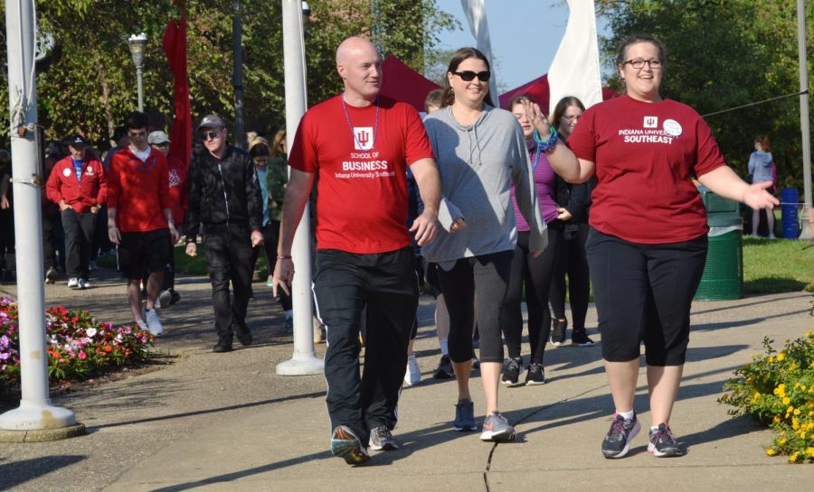 Students%2C+faculty+and+community+members+walk+in+the+Out+of+the+Darkness+walk+to+prevent+suicide.