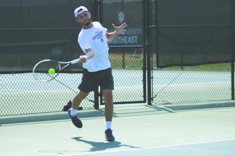 IU+Southeast+men%E2%80%99s+tennis+junior%2C+Garrett+Fensler%2C+swings+through+a+forehanded+return+in+a+Spring+2018+match.+Fensler+earned+all-conference+honors+for+his+second+consecutive+season+in+2017-18.+