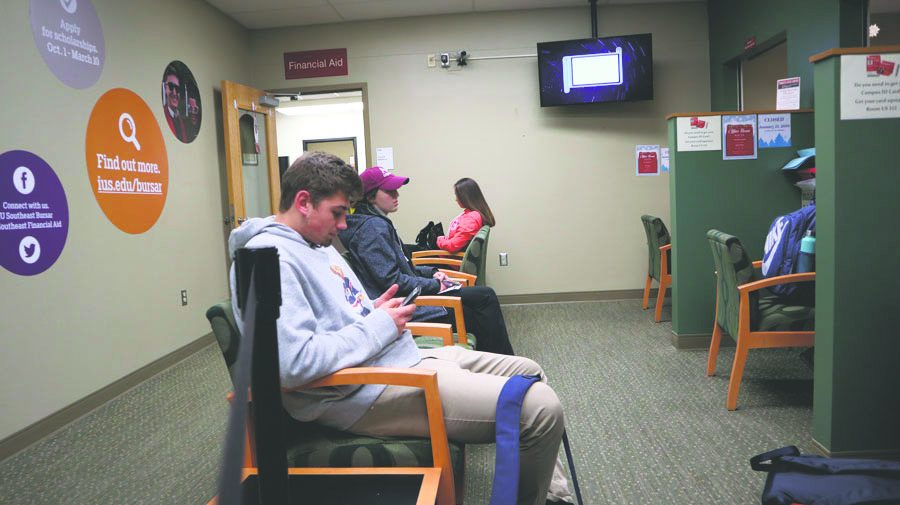 Anthony+Hodge%2C+undecided+sophomore+and+Jessica+Kay%2C+nursing+freshman%2C+waiting+in+line+to+pay+their+bursar+bills+during+the+first+week+of+classes.