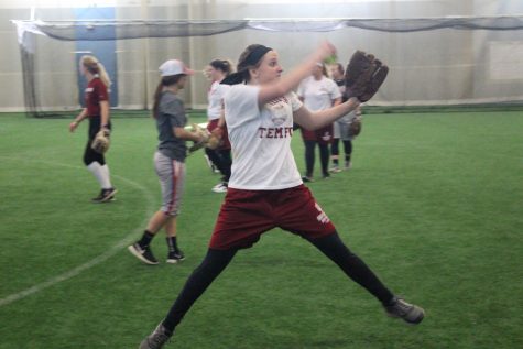 Pitcher Emily Weiss fires a pitch during an indoor practice at the Silver Street Park indoor facility in New Albany.