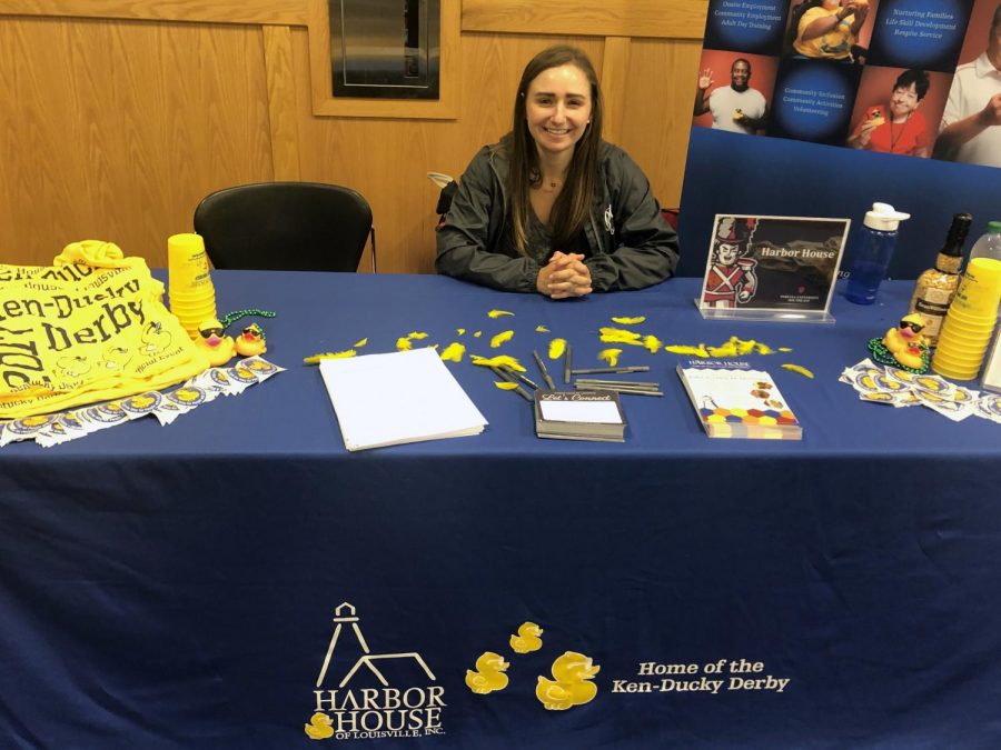 Robin+Pitmann%2C+communications+and+outreach+coordinator+for+Harbor+House+of+Louisville%2C+sits+at+her+organization%27s+table+at+the+annual+IUS+Volunteer+Fair.