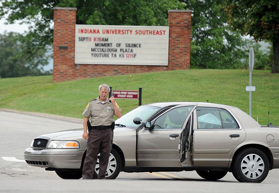 Police blocked the entrances to Indiana University Southeast after reports of a gunman on campus Thursday afternoon. The false alarm, which was actually a large umbrella in a camouflage backpack, was cleared after about an hour long sweep across campus. Photo by Tyler Stewart/News and Tribune (used with permission).