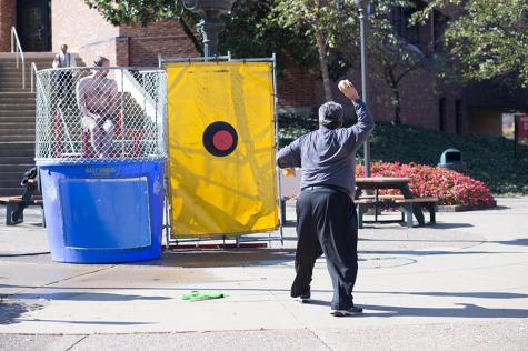 Bernardo Carducci, professor of psychology, gets his arm ready to dunk dirt bag David Spencer. 