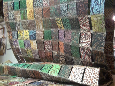 Wende Cudmore, fine arts alumnus, designed all the prints on this hanging piece at IU Southeast. The piece contains 1000 pieces of individual squares of print paper.
