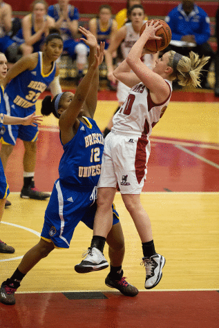 Senior Guard, Heather Wheat pulls up for an off balance shot against the Bearcats Tuesday night. Wheat had a team high 19 points.