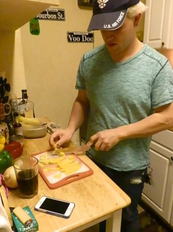 Bryan Jones, journalism senior, prepares dinner. Jones has moved eight times in recent years, and for a while stayed on friends’ couches.