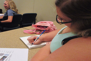 Sarah Mann, psychology sophomore, takes notes at the seminar.