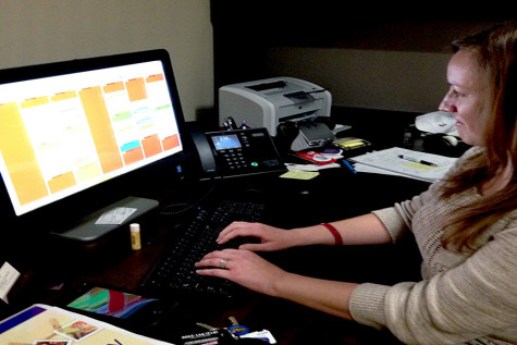 Karen Richie, counselor and care manager in Personal Counseling Services, looks at her scheduled appointments. Richie performs counseling and specializes in helping students access local resources to meet food, clothing, shelter, transportation, medical and mental health needs. 