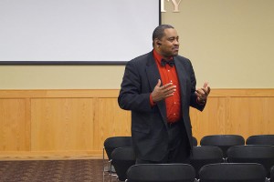 Joseph Grant, lecturer of criminology and criminal justice, leads the discussion of “Get on the Bus” after the film ended. 