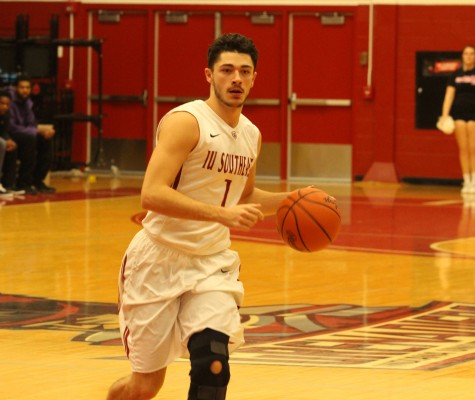 Sophomore guard Jacob Mills starts the offense off with a drive to the right of the lane.