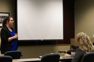 Annell Lough, outreach advisor for the Center for Women and Families, wraps up her discussion by taking questions as Melissa Fry, assistant professor of sociology and director of the Applied Research and Education Center at IU Southeast, and another attendee listen to her answers. 