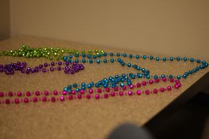 The first 28 participants in the event received necklaces. These are Mardi Gras beads. 