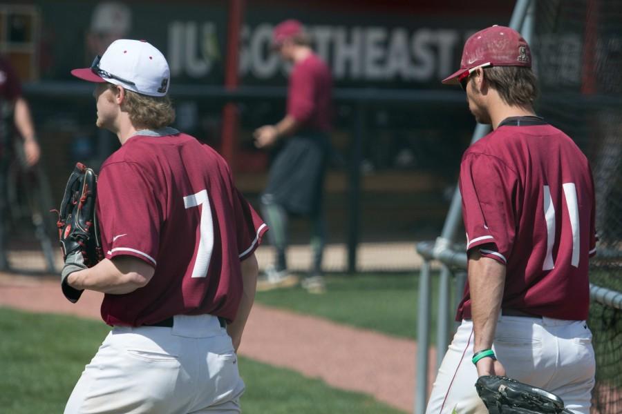 Senior+outfielder+Logan+Coughlin+%28left%29+and+Adams+%28right%29+walking+back+to+the+dugout+after+warming+up.