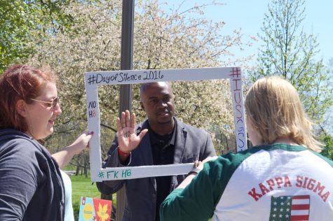 Jason Meriwether, vice chancellor for enrollment management and student affairs, stops by the booth and takes a photo for the cause.