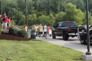 Volunteers help with campus move-in day.