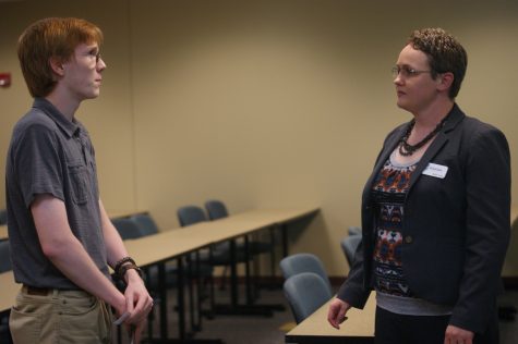 Mahri Irvine, director of campus initiatives, talks with a student about how she became involved with the Indiana Coalition to End Sexual Assault.
