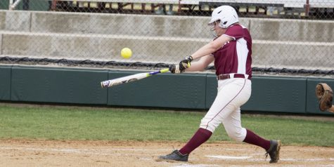 Sydney Seger, freshman, contacts the ball.