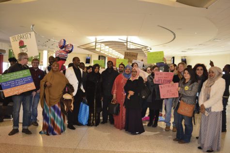Members of the Kentuckiana community gather at the Louisville International Airport on Friday, Feb. 3, to welcome the last refugees into the city before a temporary shutdown of refugee admissions begins.
