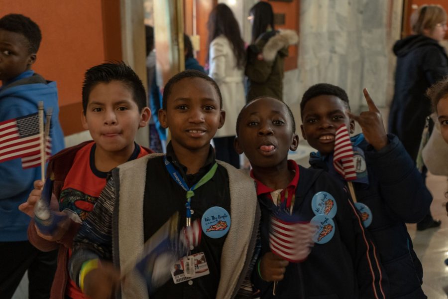 A group of children from Newcomer Academy show their support at the rally. Many students came ready to show their support at the event.