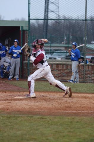 Catcher Brody Tanksley fires to second base to conclude a pre-inning warm up versus Midway University.