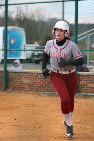 Senior Baylee Krueger heads for the dugout after scoring on a bases-loaded walk to Miranda Miller in game one of last Friday's doubleheader versus Midway University.