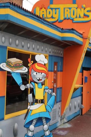 A robot mascot sits outside the door of Lady Tron's diner. Owner Summer Sieg received the nickname "Lady Tron" years ago and it became her diner's namesake.