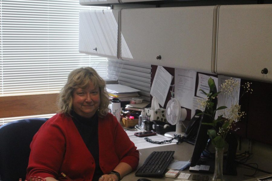 Kim+Robertson+poses+at+her+desk+in+the+Graduate+Studies+and+Research+office+in+the+University+Center.+Photo+by+Tessa+Arnold.