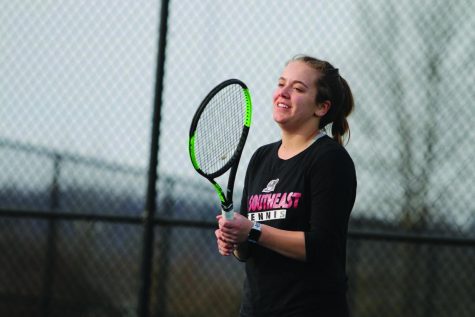 Emily Mitchell prepares to receive a serve on a muggy day. Mitchell is one of three seniors on the women’s team.